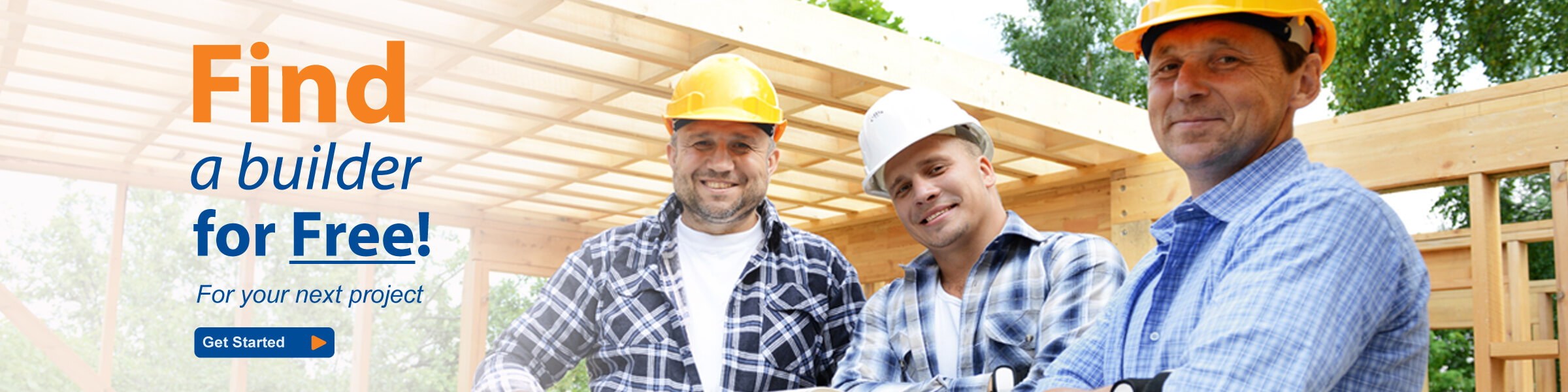 Three happy builders standing infront of a timber house frame